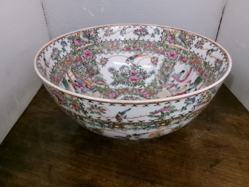 A large round Chinese Canton porcelain punch bowl decorated with hand-painted polychrome enamel panels depicting figures, flowers, and birds. View XI