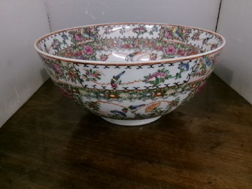 A large round Chinese Canton porcelain punch bowl decorated with hand-painted polychrome enamel panels depicting figures, flowers, and birds. View XII