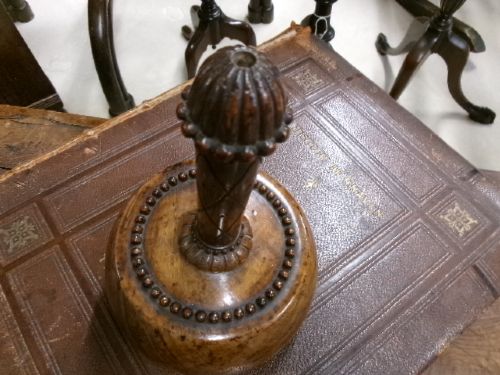 A 19th-century turned treen ceremonial mallet with a heavy rounded base and a decorative carved handle. View VIII