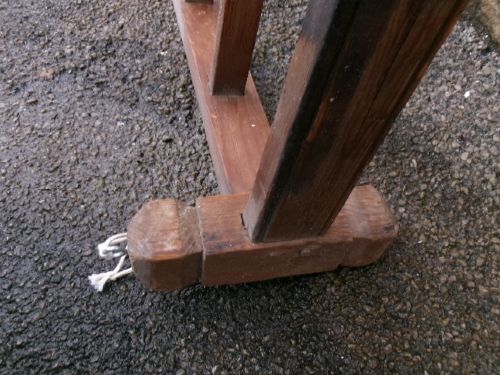 A rectangular 19th-century pine oatcake drying rack featuring slatted timber bars and hanging rope loops. View V