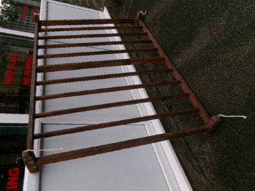 A rectangular 19th-century pine oatcake drying rack featuring slatted timber bars and hanging rope loops. View VIII