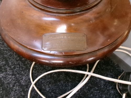 A dark turned mahogany standard lamp with a fluted central column and a moulded circular base. View IX