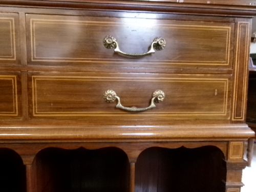 A Victorian mahogany storage unit featuring a white marble top, four inlaid drawers with brass handles, and four open lower vertical compartments. View II