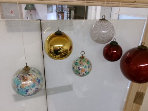 A collection of six assorted antique Victorian hand-blown glass witch balls in gold, red, and speckled colourways suspended by string. View IV