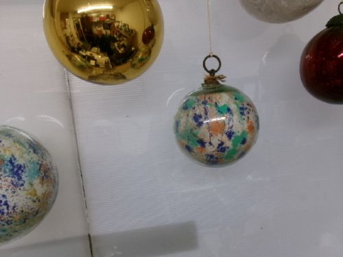 A collection of six assorted antique Victorian hand-blown glass witch balls in gold, red, and speckled colourways suspended by string. View XIV