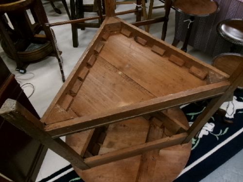 A 19th-century pine cricket table featuring a smooth round top supported by three splayed legs and a triangular undershelf. View IX