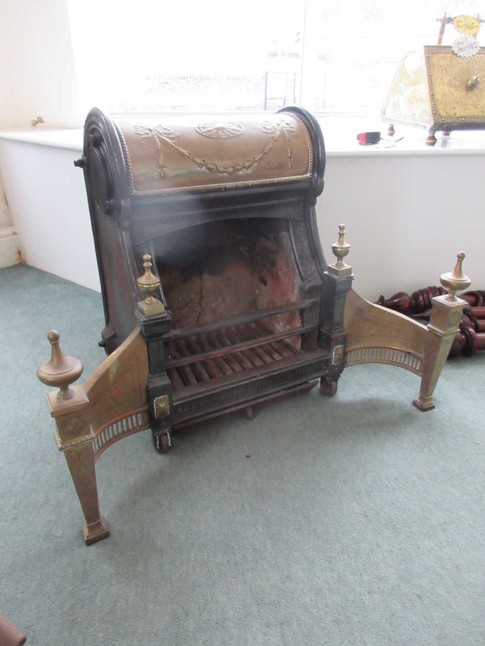 Cast Iron & Brass Nautilus Dog Grate.