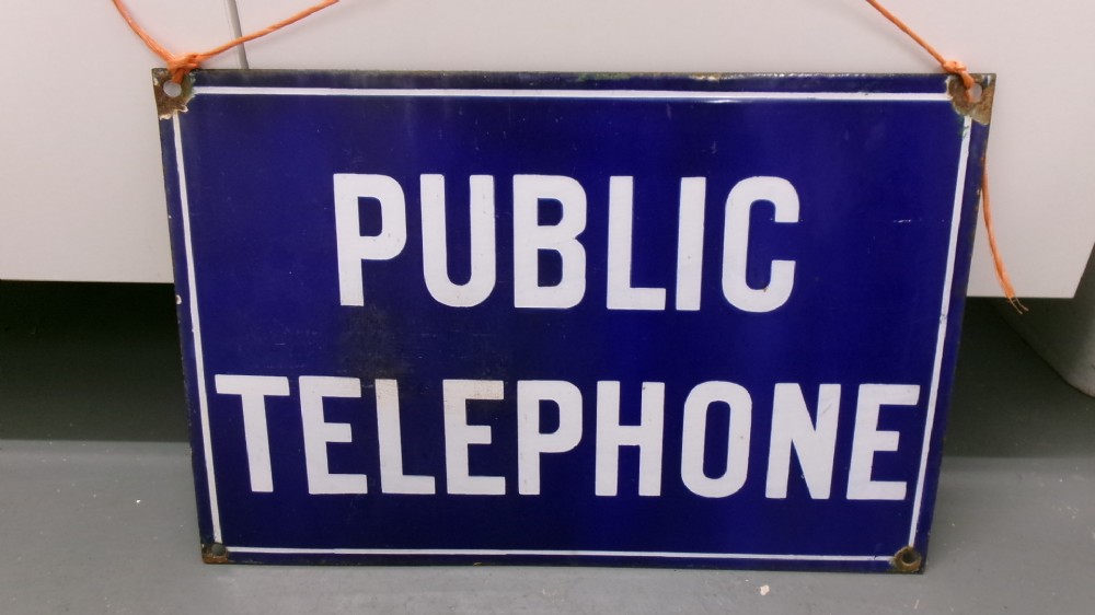 A rectangular cobalt blue vitreous enamel sign featuring the words PUBLIC TELEPHONE in bold white block capitals with a white border. View II