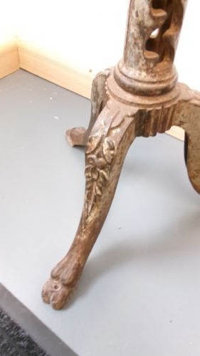 A Victorian revolving stool featuring a circular wooden seat mounted on a cast iron tripod base. View IV
