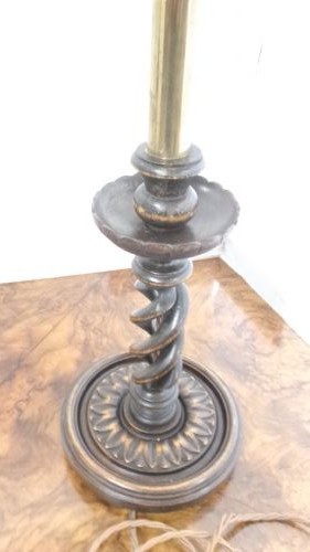 A pair of dark wood table lamps featuring carved barley twist stems, circular bases, and patterned fabric shades with fringed trim. View II