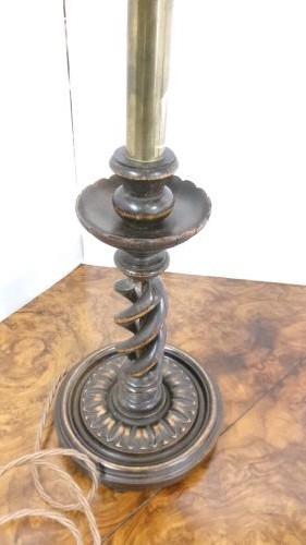 A pair of dark wood table lamps featuring carved barley twist stems, circular bases, and patterned fabric shades with fringed trim. View III