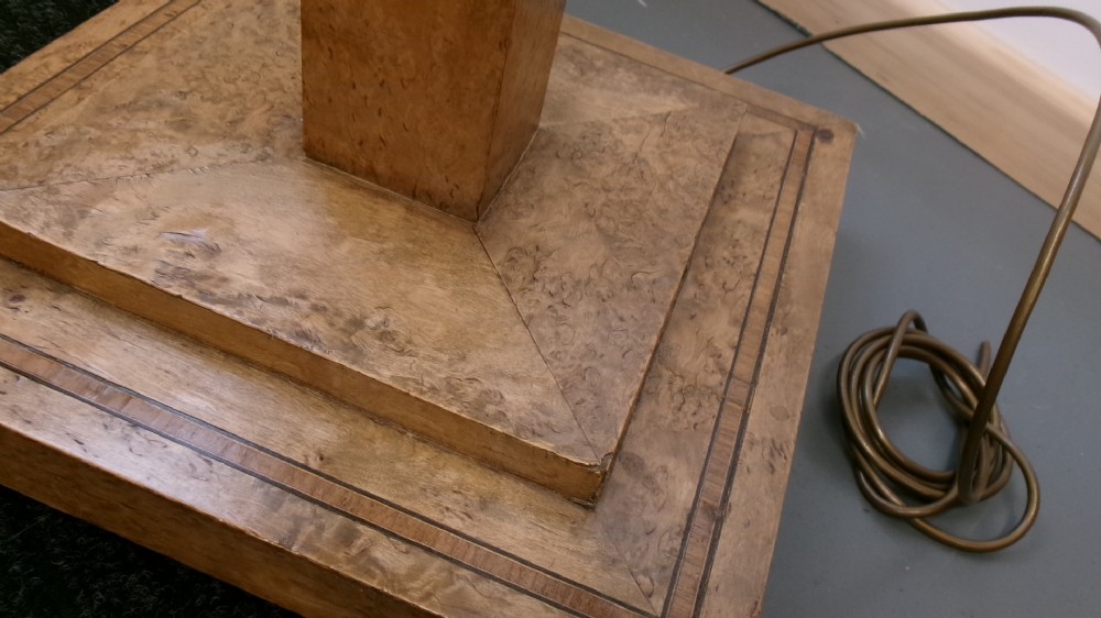 An Art Deco blond walnut standard lamp featuring a geometric stepped column and tiered square base. View X