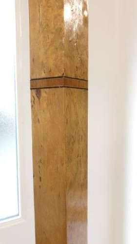 An Art Deco blond walnut standard lamp featuring a geometric stepped column and tiered square base. View IV