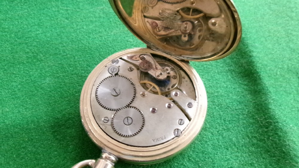 An open gold-plated full hunter pocket watch with a white enamel dial, black Arabic numerals, and a subsidiary seconds dial. View III