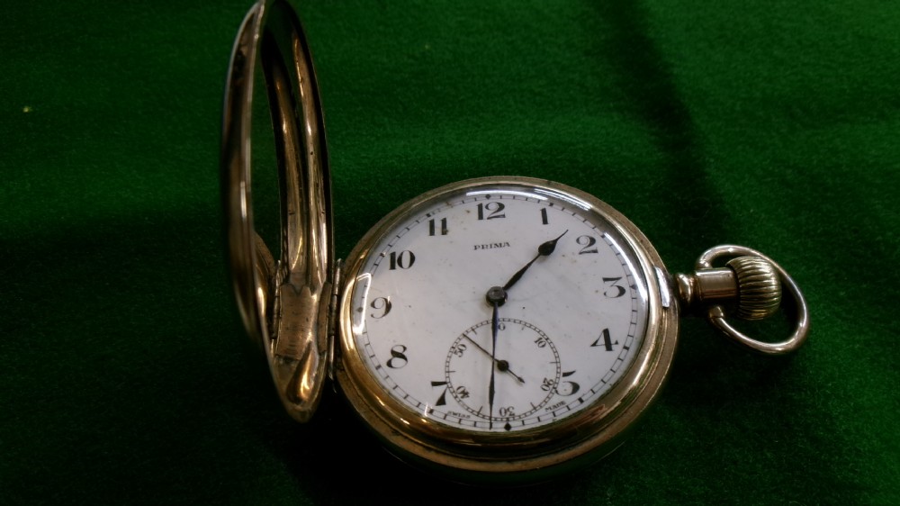 An open gold-plated full hunter pocket watch with a white enamel dial, black Arabic numerals, and a subsidiary seconds dial. View VIII