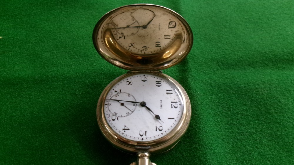 An open gold-plated full hunter pocket watch with a white enamel dial, black Arabic numerals, and a subsidiary seconds dial. View X