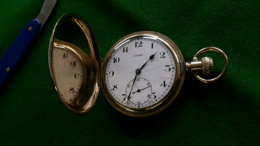 An open gold-plated full hunter pocket watch with a white enamel dial, black Arabic numerals, and a subsidiary seconds dial. View XI