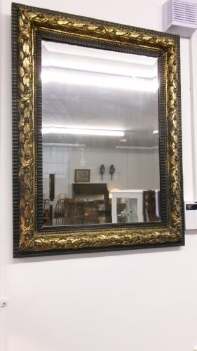 A rectangular Victorian wall mirror featuring a dark wooden frame bordered with ornate gilt brass foliate leaf moulding. View III