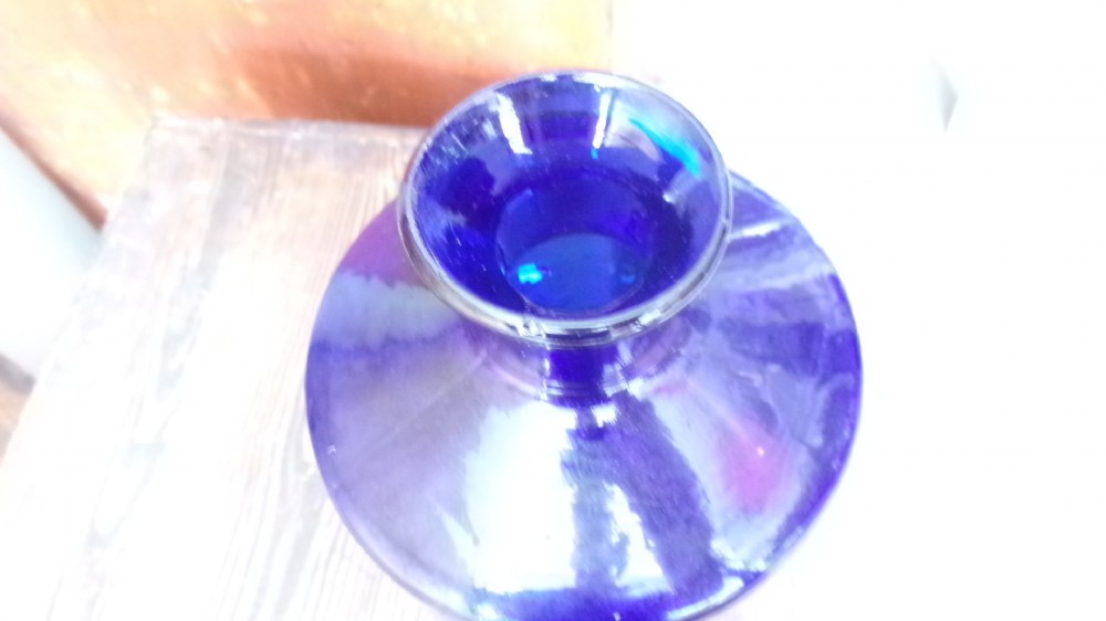 A tall Victorian cobalt blue glass apothecary bottle featuring a dark glass lollipop stopper and a gilt-bordered shield label inscribed SYR VIOLAE. View V