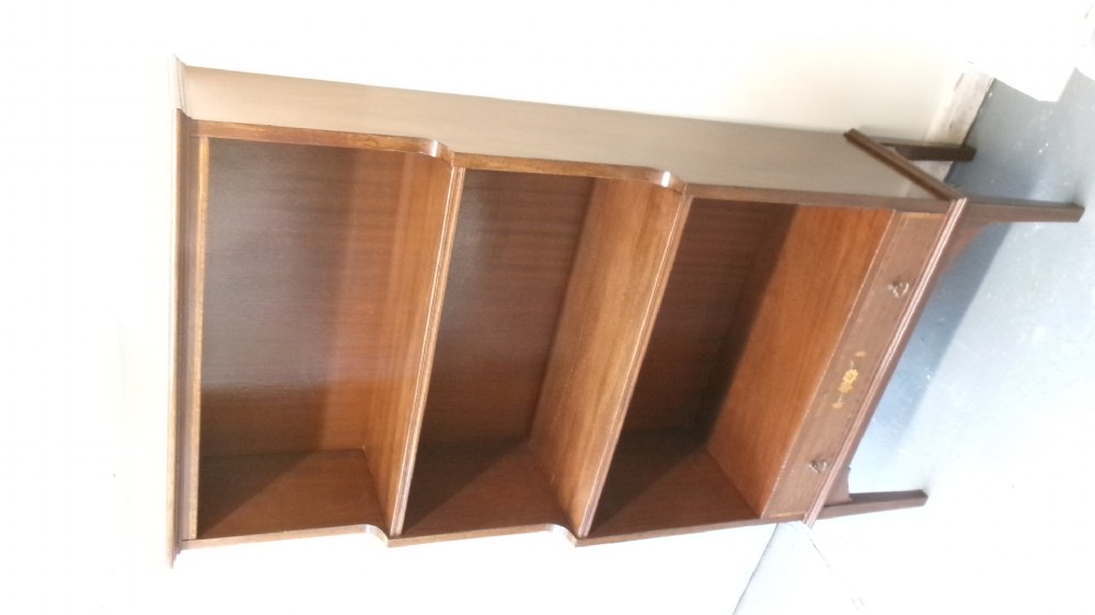 An Edwardian open mahogany bookcase featuring three shelves above a single drawer decorated with floral inlay. View VIII