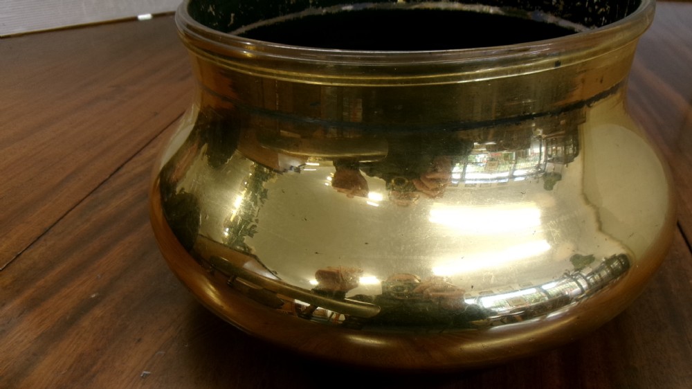 A large clear glass Victorian apothecary jar featuring a gilded coat of arms and arrowroot inscription topped with a fitted domed brass lid. View VIII