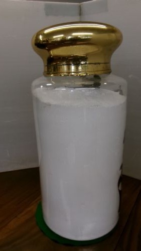 A large clear glass Victorian apothecary jar featuring a gilded coat of arms and arrowroot inscription topped with a fitted domed brass lid. View XII