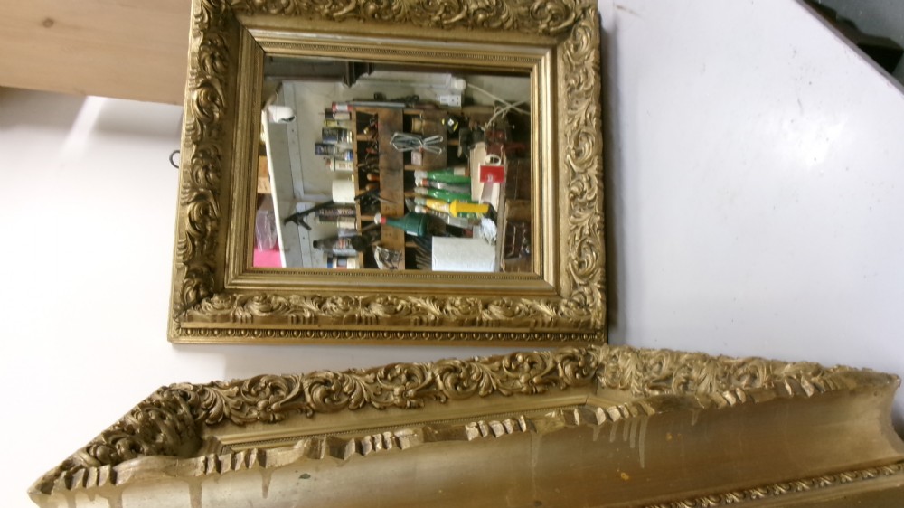 A pair of rectangular giltwood wall mirrors featuring heavily carved frame borders with acanthus leaf scrolling and beaded inner moulding. View IX