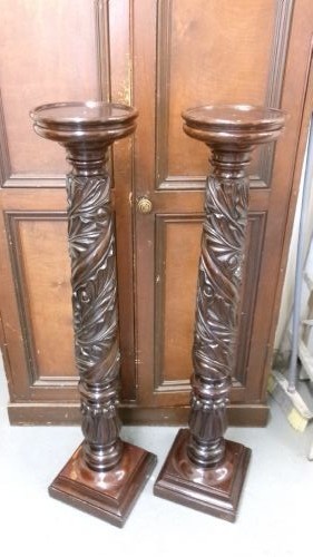 A pair of tall Victorian dark mahogany torchere stands featuring circular dished tops, spiral acanthus leaf carved shafts, and square plinth bases. View VIII