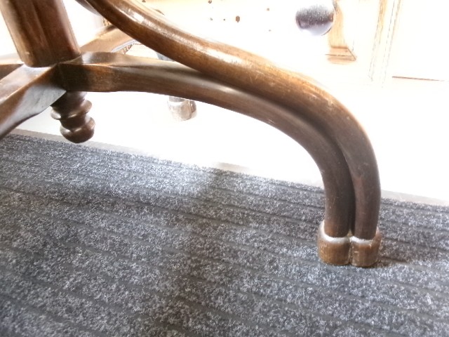 A dark brown bentwood hat and coat stand featuring multiple curved upper hooks, a circular ring, and a four-legged splayed base. View IV