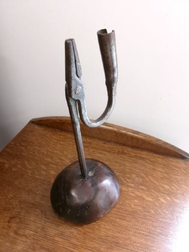 An 18th-century hand-forged wrought iron rushlight holder with an integrated candle socket, mounted on a turned dome fruitwood base. View II