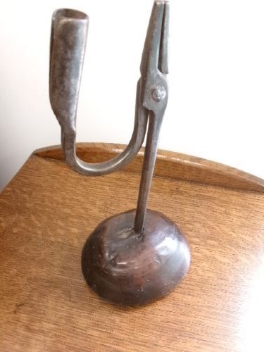 An 18th-century hand-forged wrought iron rushlight holder with an integrated candle socket, mounted on a turned dome fruitwood base. View IV
