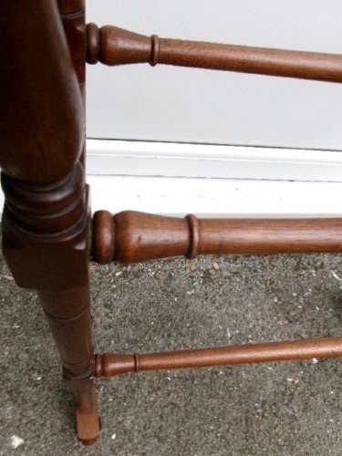 A freestanding Victorian mahogany towel rail featuring arched side supports, turned upright spindles, and four horizontal crossbars. View III