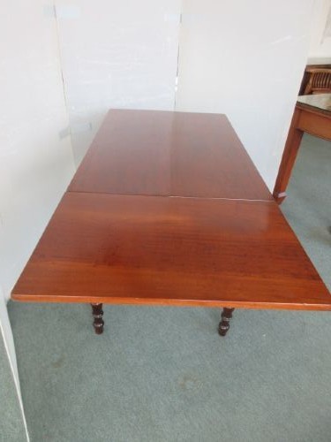 A Victorian mahogany draw leaf dining table with turned legs and a single frieze drawer with a wooden knob. View VI