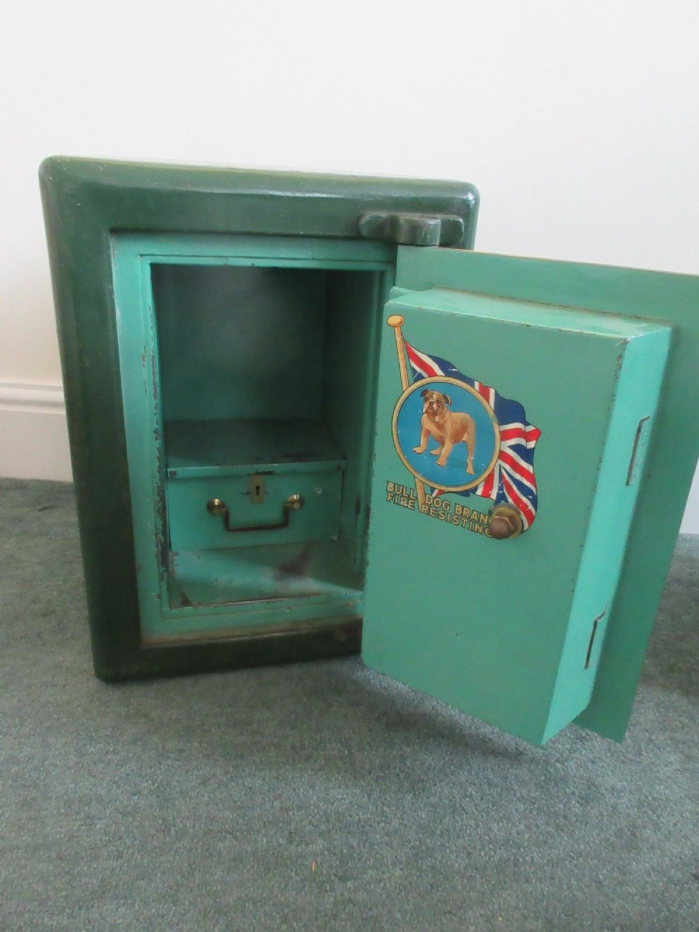 A Victorian mahogany cabinet with a white marble top, featuring an open door revealing an enclosed green cast iron safe inside. View III