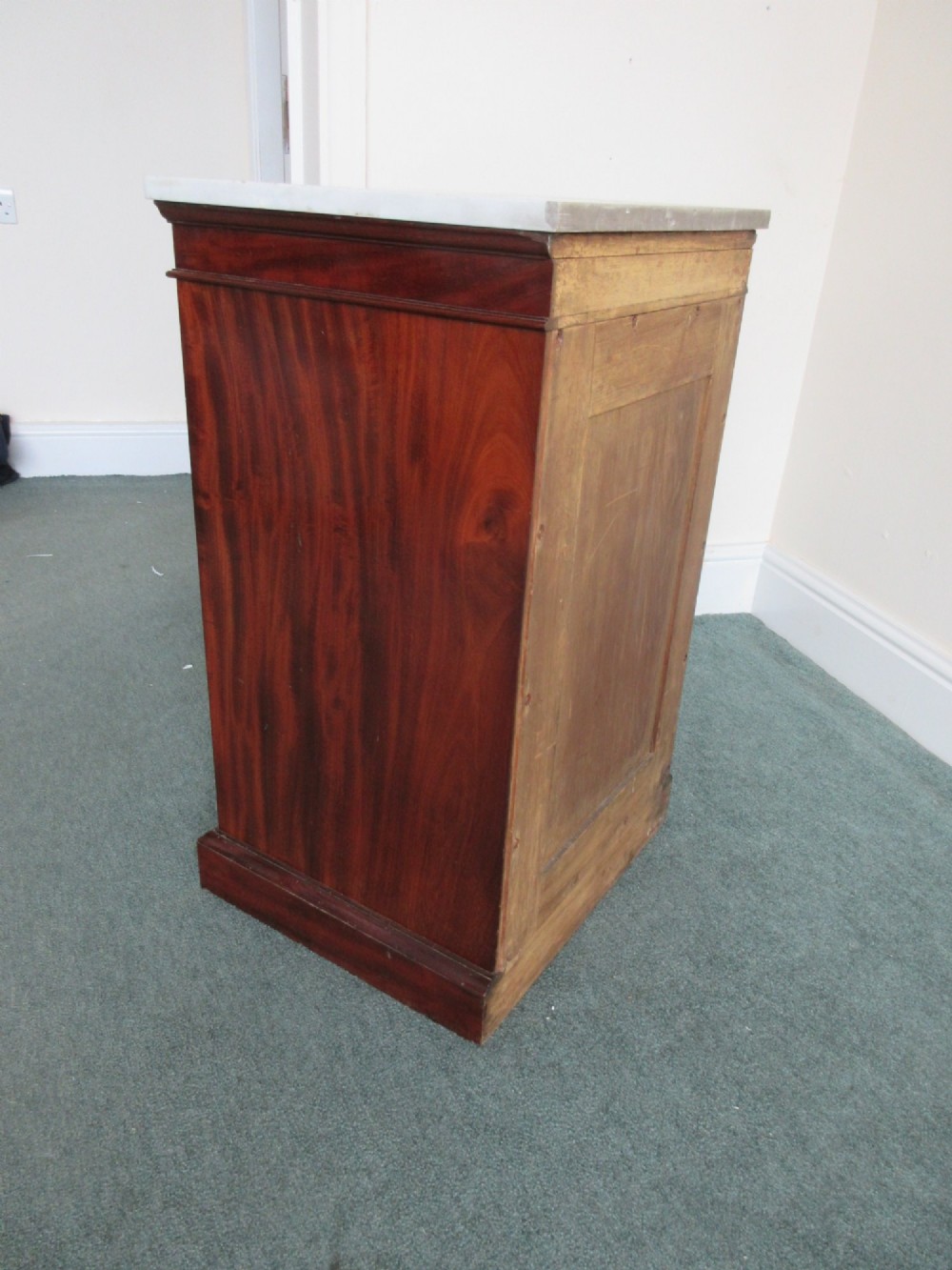 A Victorian mahogany cabinet with a white marble top, featuring an open door revealing an enclosed green cast iron safe inside. View IX