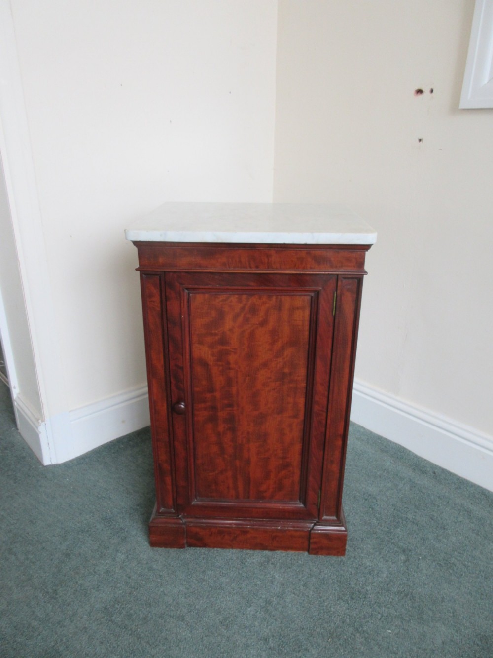 A Victorian mahogany cabinet with a white marble top, featuring an open door revealing an enclosed green cast iron safe inside. View X