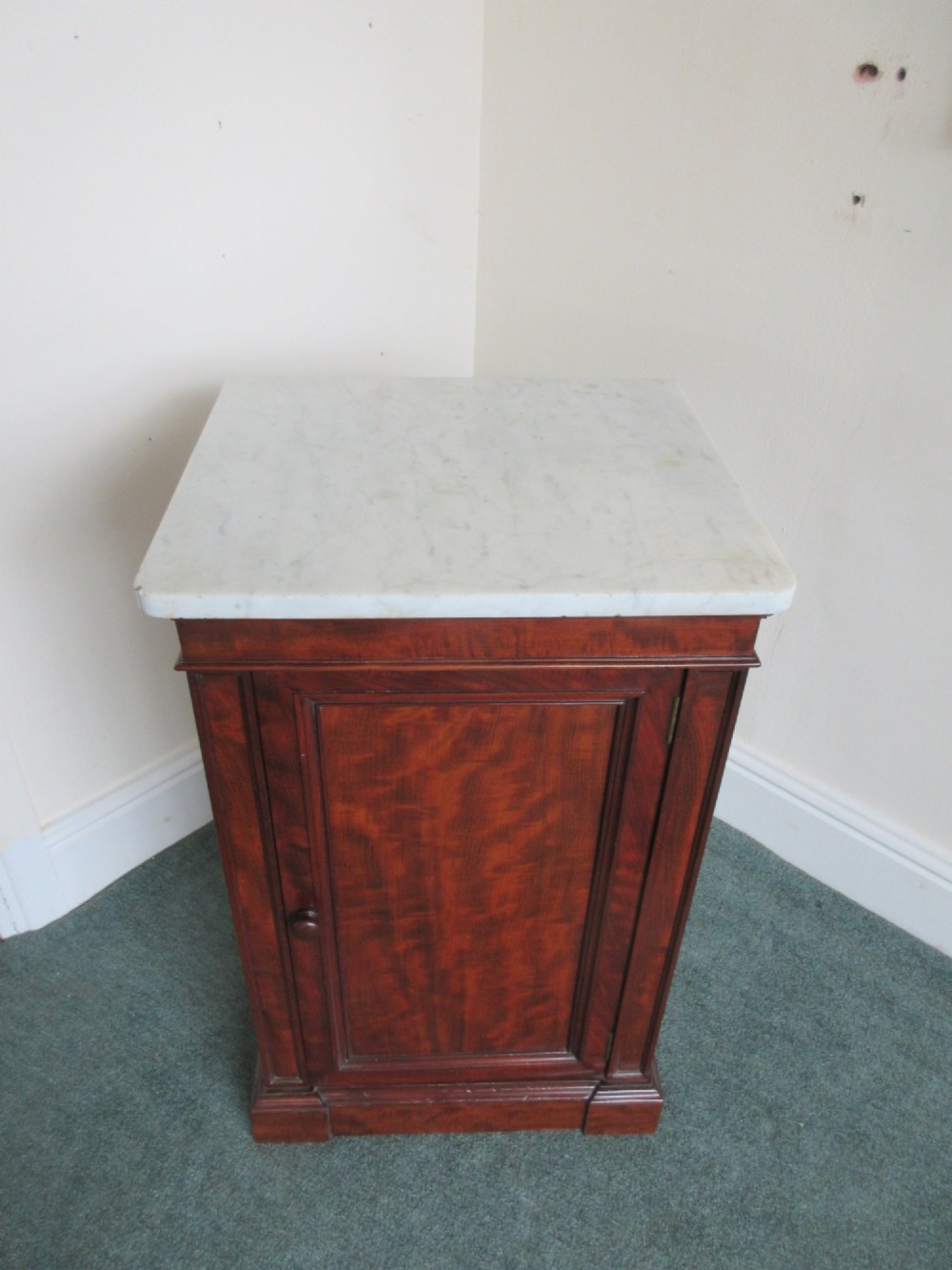 A Victorian mahogany cabinet with a white marble top, featuring an open door revealing an enclosed green cast iron safe inside. View XI