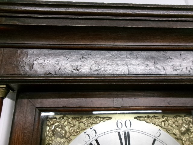 An 18th-century Georgian dark oak longcase clock featuring a square brass dial, fluted hood columns, and a moulded base. View VIII