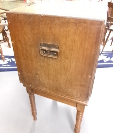 A pine military campaign chest featuring flush recessed brass handles and multiple small drawers. View VII