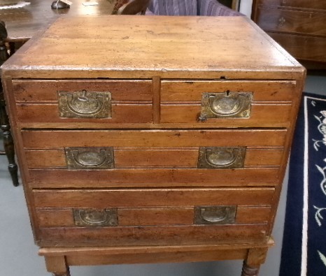 A pine military campaign chest featuring flush recessed brass handles and multiple small drawers. View XI