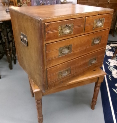 A pine military campaign chest featuring flush recessed brass handles and multiple small drawers. View XIII