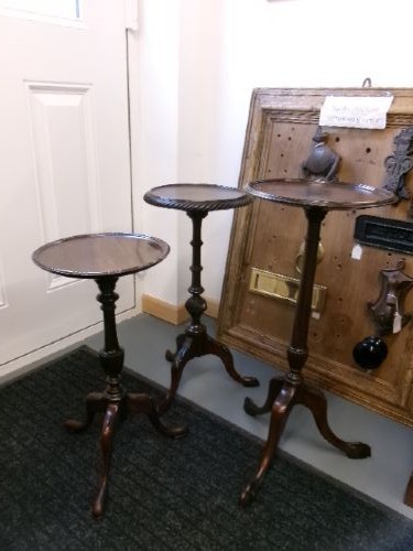 A trio of Edwardian mahogany wine tables featuring turned central pedestals, dished circular tops, and carved tripod cabriole legs. View III