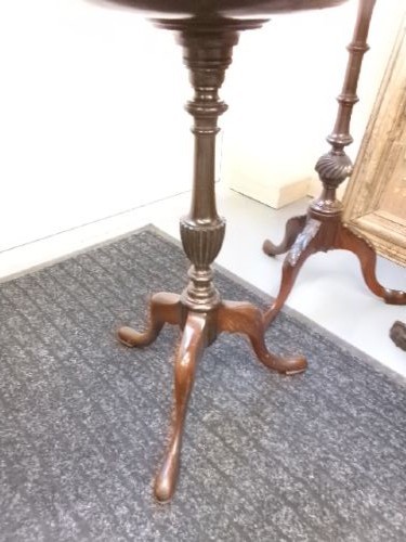 A trio of Edwardian mahogany wine tables featuring turned central pedestals, dished circular tops, and carved tripod cabriole legs. View V