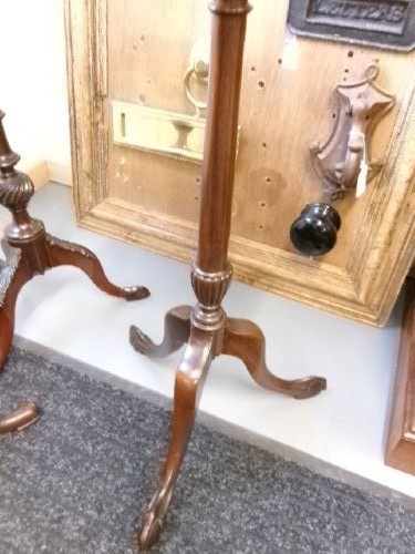 A trio of Edwardian mahogany wine tables featuring turned central pedestals, dished circular tops, and carved tripod cabriole legs. View VII