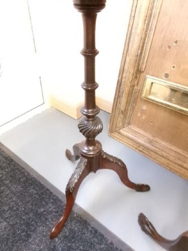 A trio of Edwardian mahogany wine tables featuring turned central pedestals, dished circular tops, and carved tripod cabriole legs. View VI