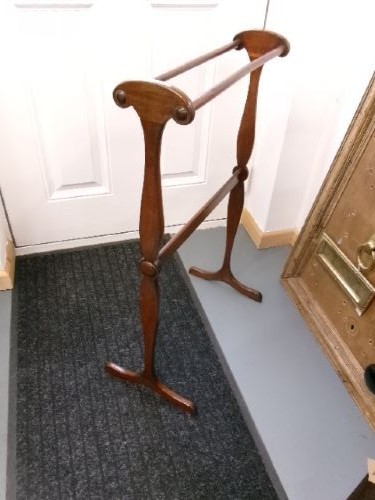 A Victorian mahogany freestanding towel rail featuring double turned crossbars, shaped vertical uprights with scrolled top handles, and splayed feet. View VI
