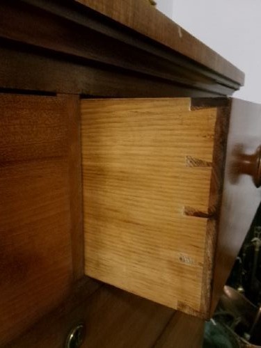 A tall Victorian mahogany chest of drawers featuring two short upper drawers above four long drawers with turned wooden knobs and a solid plinth base. View II