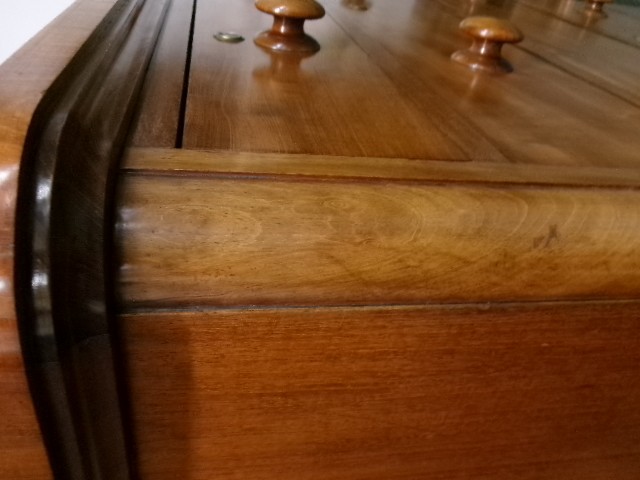 A tall Victorian mahogany chest of drawers featuring two short upper drawers above four long drawers with turned wooden knobs and a solid plinth base. View VI
