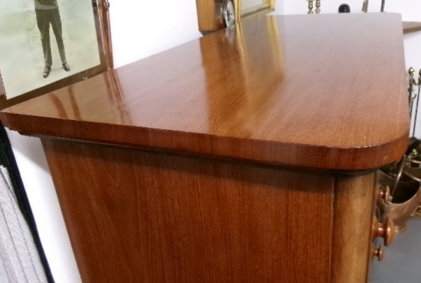 A tall Victorian mahogany chest of drawers featuring two short upper drawers above four long drawers with turned wooden knobs and a solid plinth base. View VII