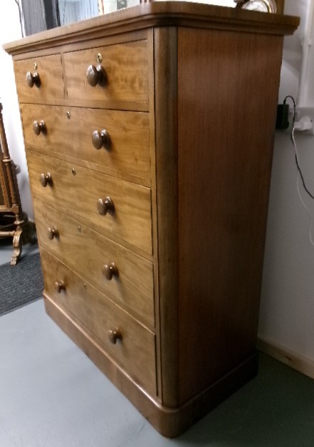A tall Victorian mahogany chest of drawers featuring two short upper drawers above four long drawers with turned wooden knobs and a solid plinth base. View VIII